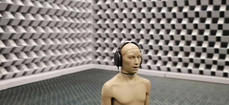 Statue with headphones in sound studio