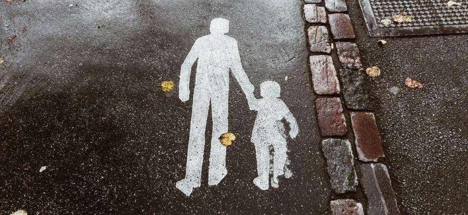 Image of two people walking on the sidewalk