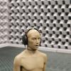 Statue with headphones in sound studio