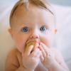 Unsplash A baby with a toy in the mouth.